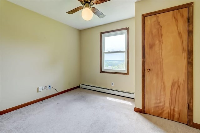 1566 Tracy Dr, Spafford, NY 13152 - unfurnished bedroom featuring a baseboard heating unit, light carpet, and ceiling fan
