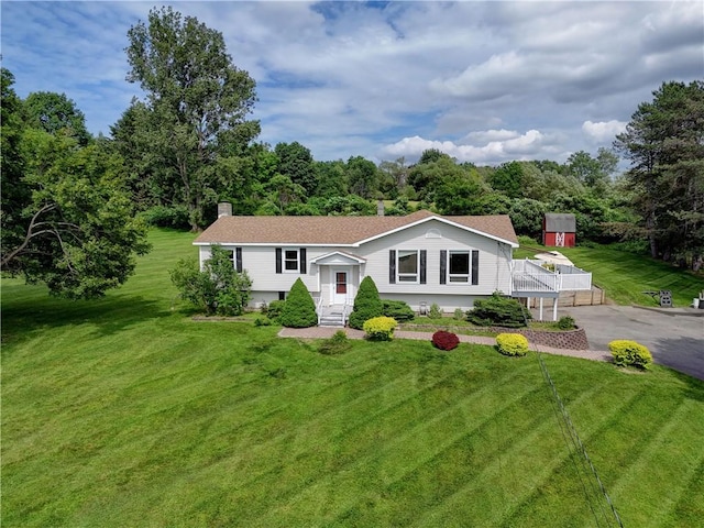 1566 Tracy Dr, Spafford, NY 13152 - split foyer home with a front yard, a chimney, entry steps, and a shingled roof