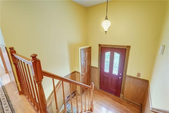 1566 Tracy Dr, Spafford, NY 13152 - entryway with a wainscoted wall, light wood-style floors, and a high ceiling