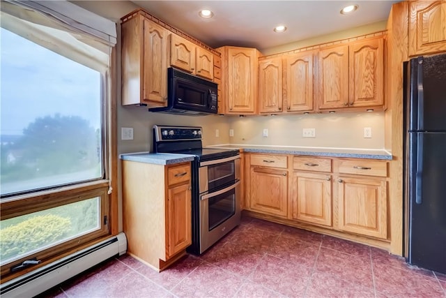 1566 Tracy Dr, Spafford, NY 13152 - kitchen featuring a baseboard radiator, black appliances, recessed lighting, light brown cabinets, and light countertops