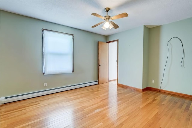 1566 Tracy Dr, Spafford, NY 13152 - unfurnished room featuring a baseboard radiator, light wood-type flooring, and ceiling fan