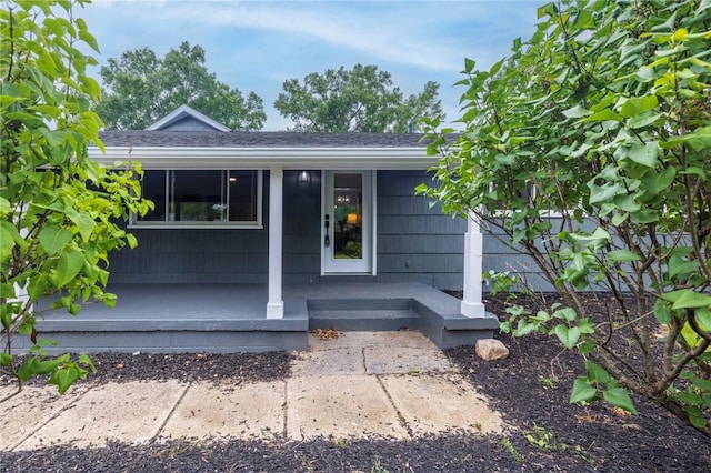23 Kerry Park, Henrietta, NY 14534 - entrance to property featuring covered porch and a shingled roof