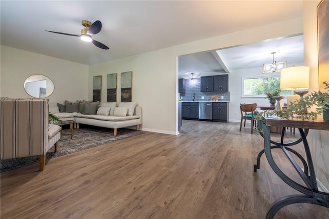 23 Kerry Park, Henrietta, NY 14534 - living area with wood finished floors, a ceiling fan, and a chandelier