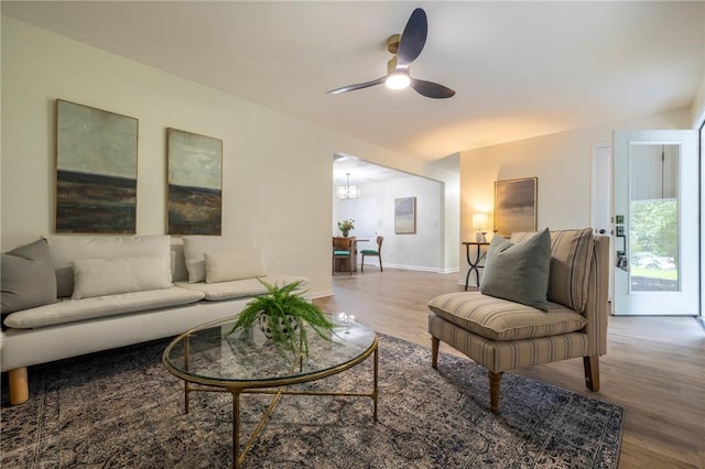 23 Kerry Park, Henrietta, NY 14534 - living room featuring wood finished floors, ceiling fan, and a chandelier