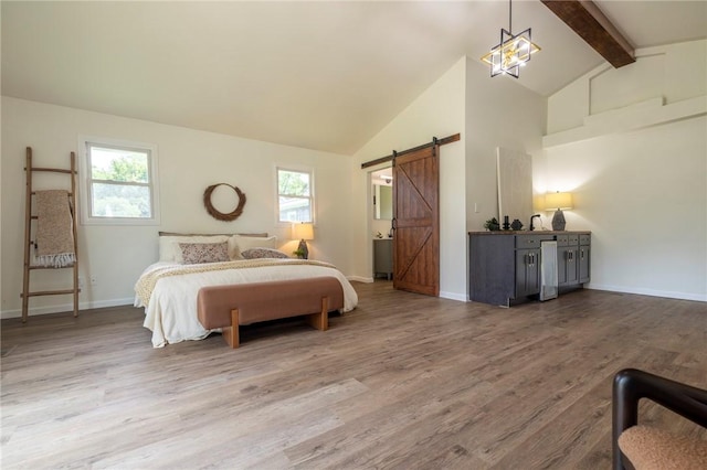 23 Kerry Park, Henrietta, NY 14534 - bedroom featuring a barn door, wood finished floors, beam ceiling, and high vaulted ceiling