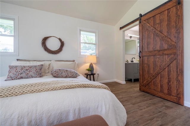 23 Kerry Park, Henrietta, NY 14534 - bedroom with a barn door, wood finished floors, multiple windows, and lofted ceiling