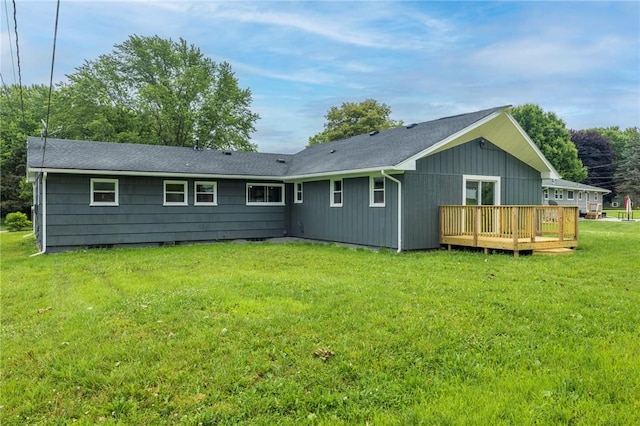 23 Kerry Park, Henrietta, NY 14534 - back of house featuring a wooden deck and a lawn