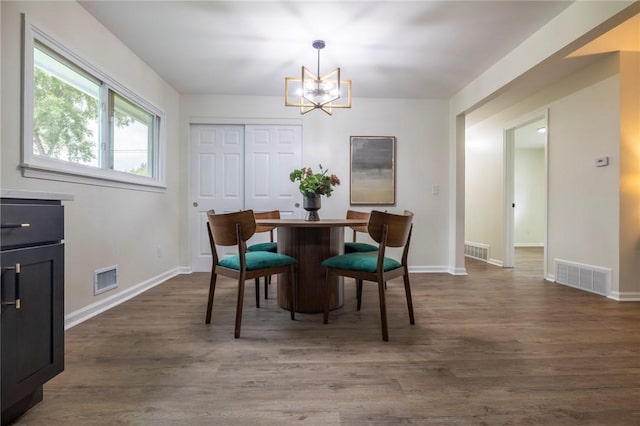 23 Kerry Park, Henrietta, NY 14534 - dining space featuring a chandelier and dark wood-style floors