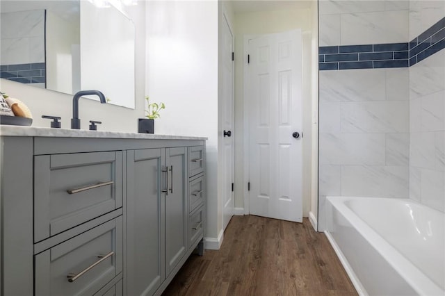 23 Kerry Park, Henrietta, NY 14534 - bathroom featuring vanity, wood finished floors, and bathtub / shower combination