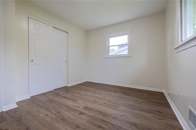 23 Kerry Park, Henrietta, NY 14534 - unfurnished bedroom with wood finished floors and a closet