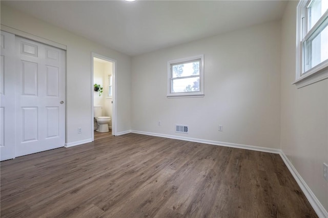 23 Kerry Park, Henrietta, NY 14534 - unfurnished bedroom featuring dark wood-style flooring and ensuite bath