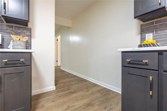 23 Kerry Park, Henrietta, NY 14534 - kitchen featuring light wood finished floors and light stone counters