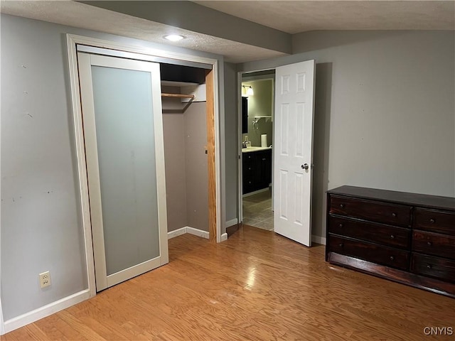 19 Beech Dr, Scriba, NY 13126 - unfurnished bedroom with light wood-style floors and a closet