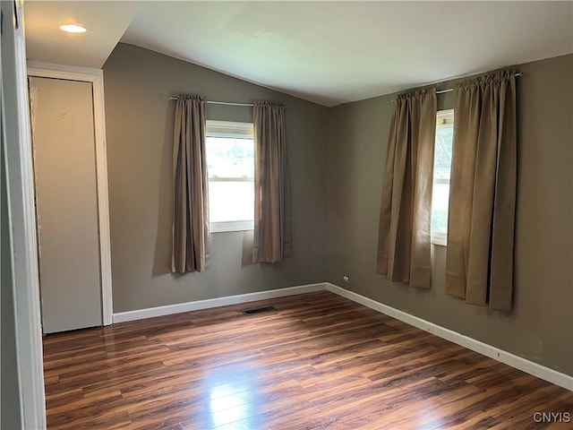 19 Beech Dr, Scriba, NY 13126 - unfurnished room with vaulted ceiling and dark wood-type flooring