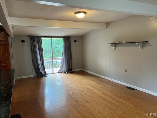 19 Beech Dr, Scriba, NY 13126 - empty room featuring beamed ceiling and light wood-style flooring