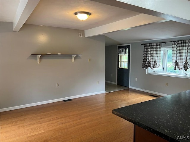 19 Beech Dr, Scriba, NY 13126 - unfurnished living room featuring beam ceiling and wood finished floors