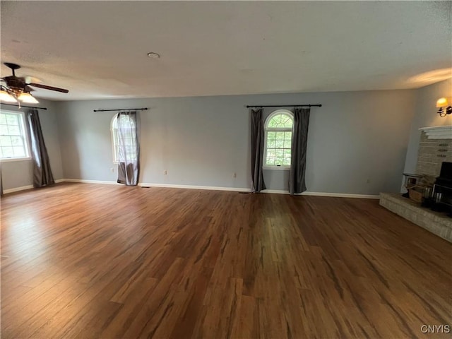 19 Beech Dr, Scriba, NY 13126 - unfurnished living room featuring plenty of natural light, wood finished floors, a ceiling fan, and a textured ceiling