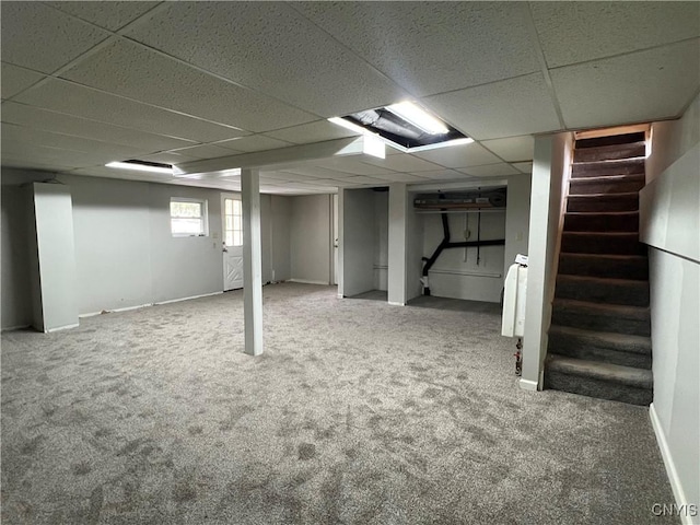 19 Beech Dr, Scriba, NY 13126 - below grade area with carpet flooring, a paneled ceiling, and stairway