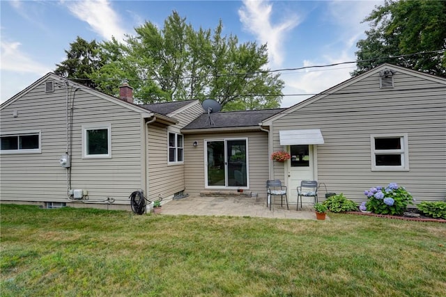 286 Park Ln, Webster, NY 14580 - rear view of house with a chimney, a patio, and a lawn