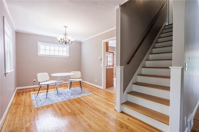 79 Meredith Ave, Brighton, NY 14618 - dining space featuring ornamental molding, stairway, light wood-style flooring, a chandelier, and plenty of natural light