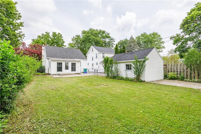 79 Meredith Ave, Brighton, NY 14618 - back of property featuring an outbuilding, a patio area, and a chimney