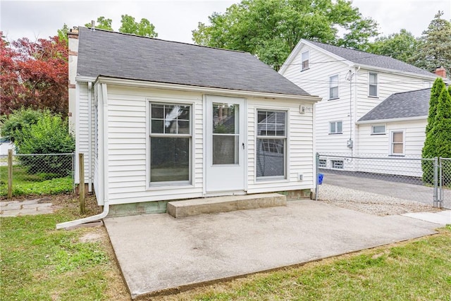 79 Meredith Ave, Brighton, NY 14618 - rear view of house with a patio area and a chimney