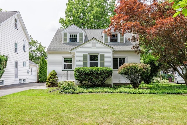 79 Meredith Ave, Brighton, NY 14618 - view of front facade featuring roof with shingles and a front yard