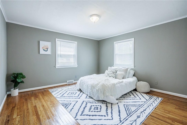 79 Meredith Ave, Brighton, NY 14618 - bedroom with multiple windows, ornamental molding, and wood finished floors