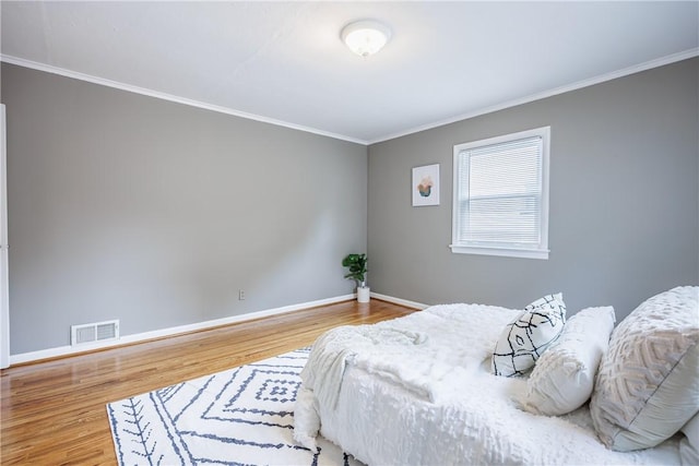 79 Meredith Ave, Brighton, NY 14618 - bedroom featuring wood finished floors and crown molding