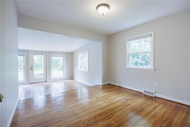 79 Meredith Ave, Brighton, NY 14618 - unfurnished room featuring wood-type flooring and lofted ceiling