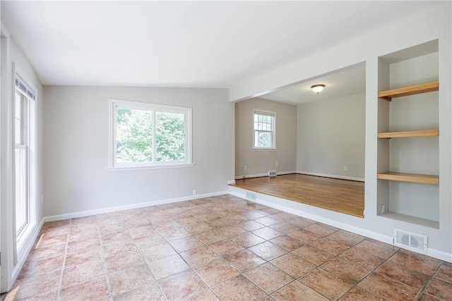 79 Meredith Ave, Brighton, NY 14618 - unfurnished room featuring built in features and baseboards