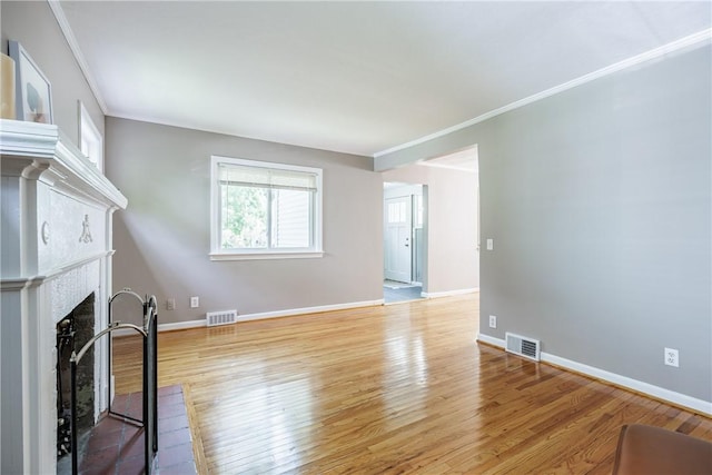 79 Meredith Ave, Brighton, NY 14618 - unfurnished living room featuring ornamental molding, wood finished floors, and a fireplace