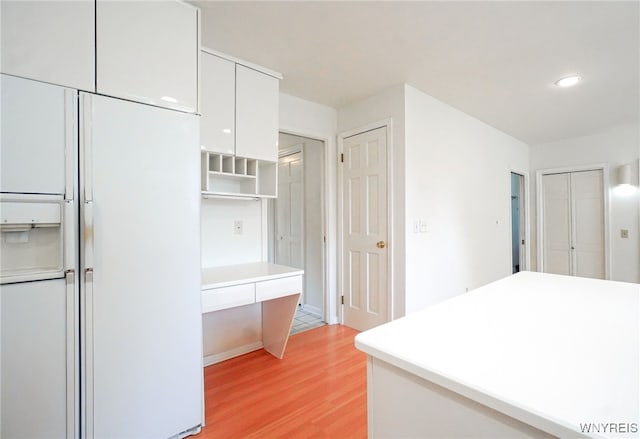 100 W Maplemere Rd, Amherst, NY 14221 - kitchen with white cabinetry, light wood-style flooring, open shelves, white refrigerator with ice dispenser, and light countertops