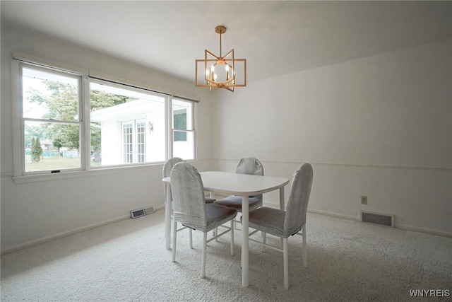 100 W Maplemere Rd, Amherst, NY 14221 - dining area with a chandelier, plenty of natural light, and carpet flooring