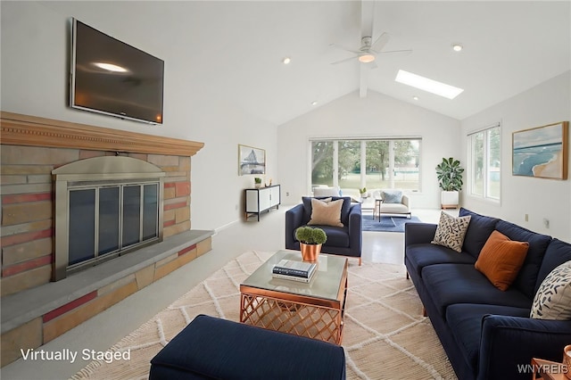 100 W Maplemere Rd, Amherst, NY 14221 - living area with a skylight, a glass covered fireplace, beamed ceiling, ceiling fan, and high vaulted ceiling