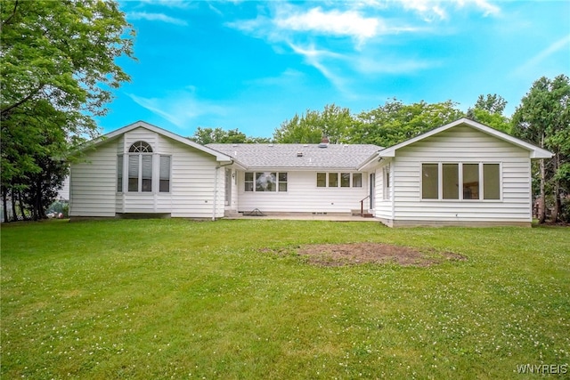 100 W Maplemere Rd, Amherst, NY 14221 - rear view of property with a patio area, a lawn, and roof with shingles