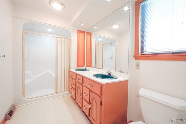 100 W Maplemere Rd, Amherst, NY 14221 - full bathroom featuring a shower stall, double vanity, and recessed lighting