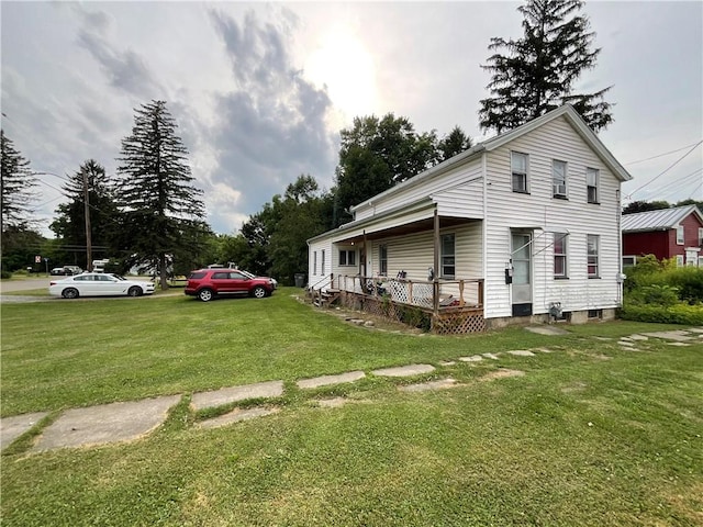 22 Jefferson St, North Dansville, NY 14437 - view of property exterior with a yard and covered porch