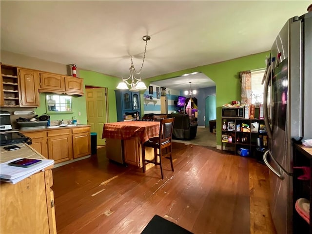 22 Jefferson St, North Dansville, NY 14437 - kitchen with stainless steel appliances, light countertops, dark wood finished floors, open shelves, and plenty of natural light