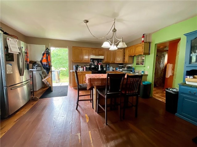 22 Jefferson St, North Dansville, NY 14437 - kitchen featuring stainless steel fridge with ice dispenser, under cabinet range hood, dark wood finished floors, and a chandelier