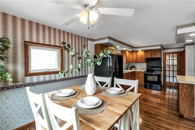 128 Princeton Blvd, Tonawanda, NY 14217 - dining room featuring wallpapered walls, ceiling fan, and dark wood-type flooring