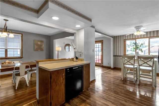 128 Princeton Blvd, Tonawanda, NY 14217 - kitchen with dishwasher, dark wood-style flooring, light countertops, recessed lighting, and hanging light fixtures