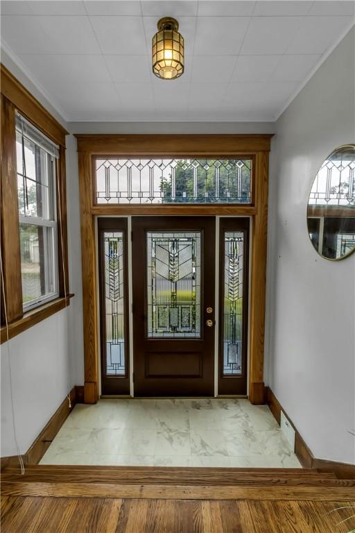 128 Princeton Blvd, Tonawanda, NY 14217 - foyer featuring baseboards and ornamental molding