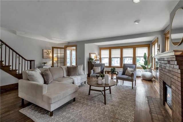 128 Princeton Blvd, Tonawanda, NY 14217 - living area featuring dark wood-style floors, a fireplace, and stairs
