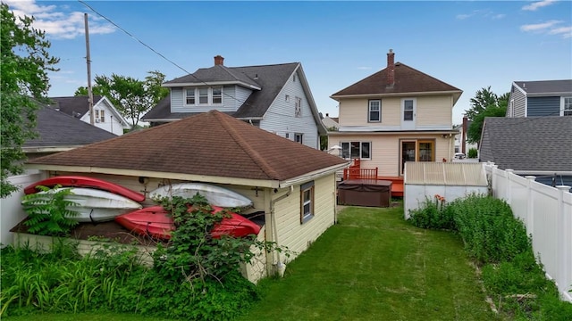 128 Princeton Blvd, Tonawanda, NY 14217 - rear view of house with a hot tub and roof with shingles