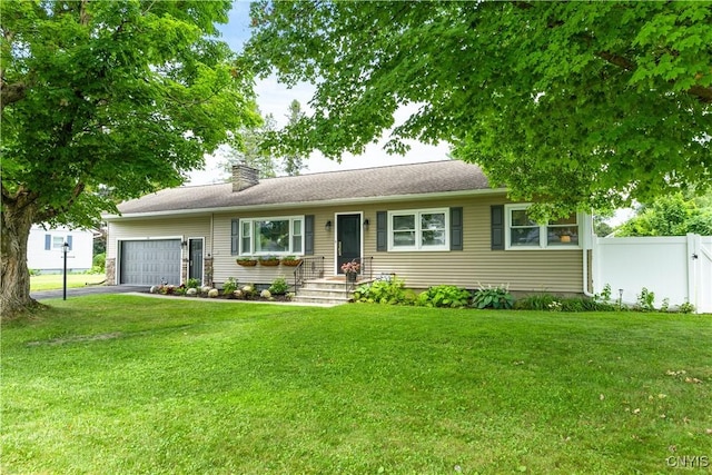 102 W Rand St, German Flatts, NY 13357 - ranch-style house with a garage, a chimney, and driveway