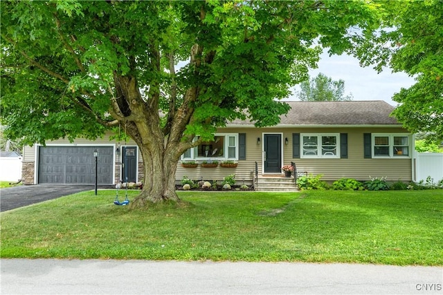 102 W Rand St, German Flatts, NY 13357 - ranch-style home featuring asphalt driveway, a garage, and a front yard