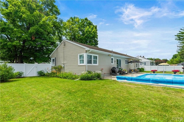 102 W Rand St, German Flatts, NY 13357 - back of property featuring a fenced backyard, a patio, and a gate