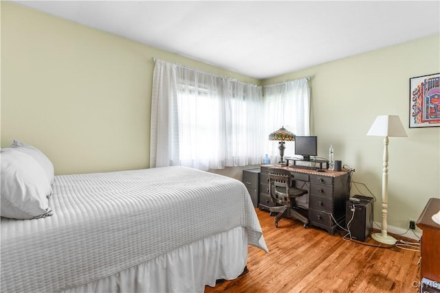 102 W Rand St, German Flatts, NY 13357 - bedroom featuring wood finished floors and an office area