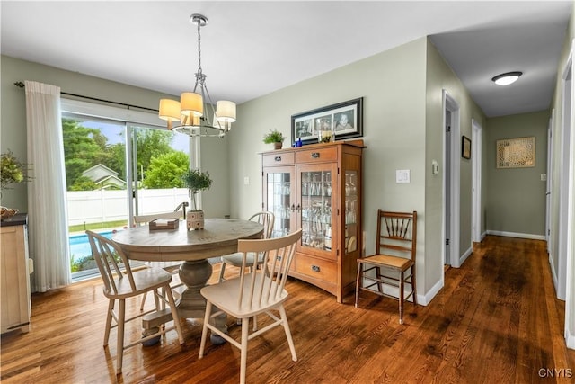 102 W Rand St, German Flatts, NY 13357 - dining area featuring a chandelier, wood finished floors, and plenty of natural light